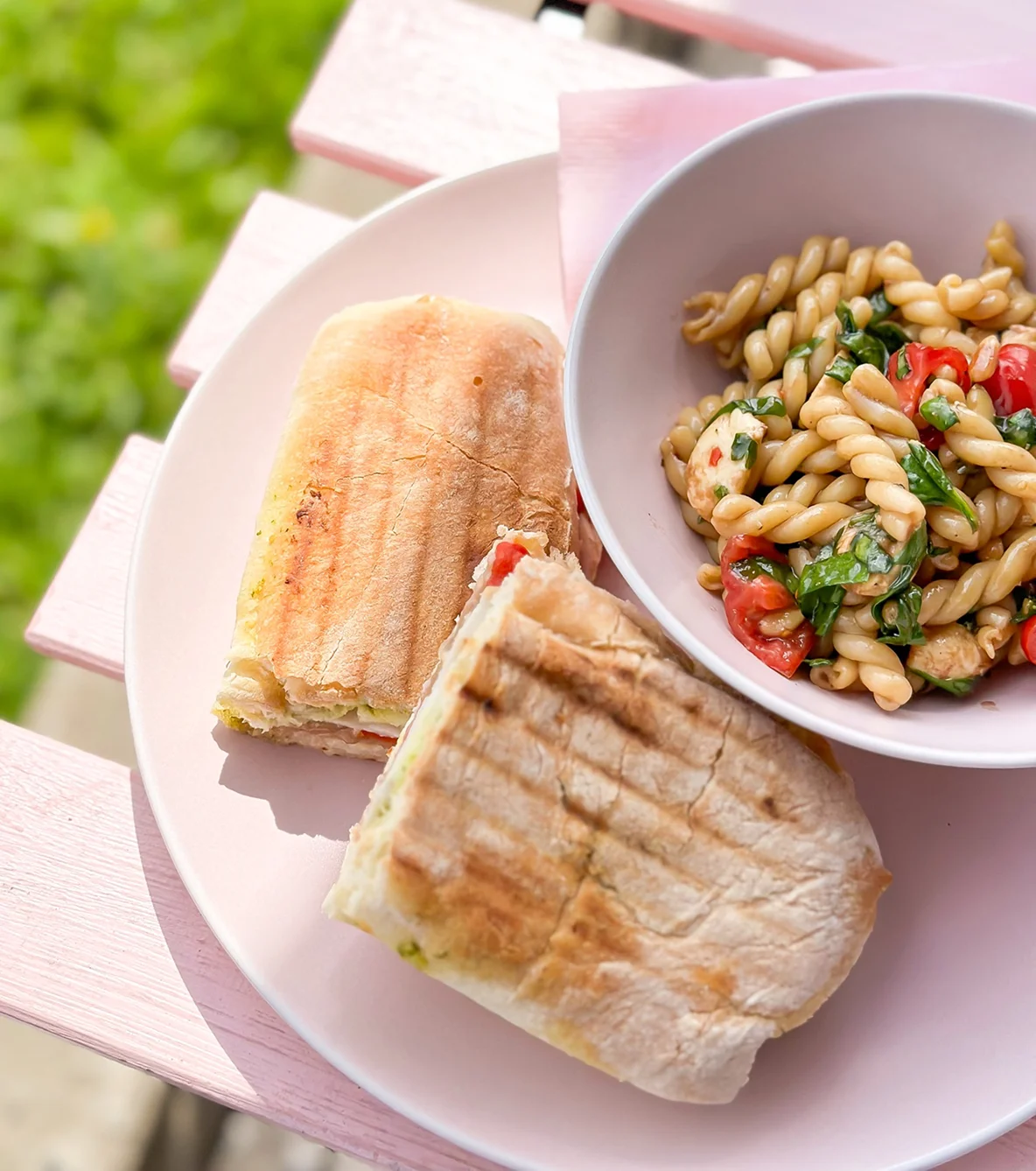 Plate with a panini and a pasta salad
